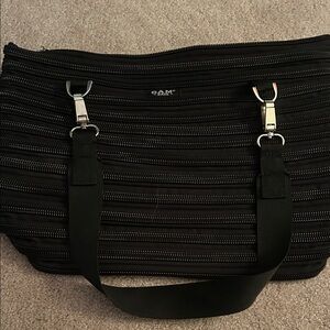 Bam Bags flat bottom bag made from a single,continuous zipper black